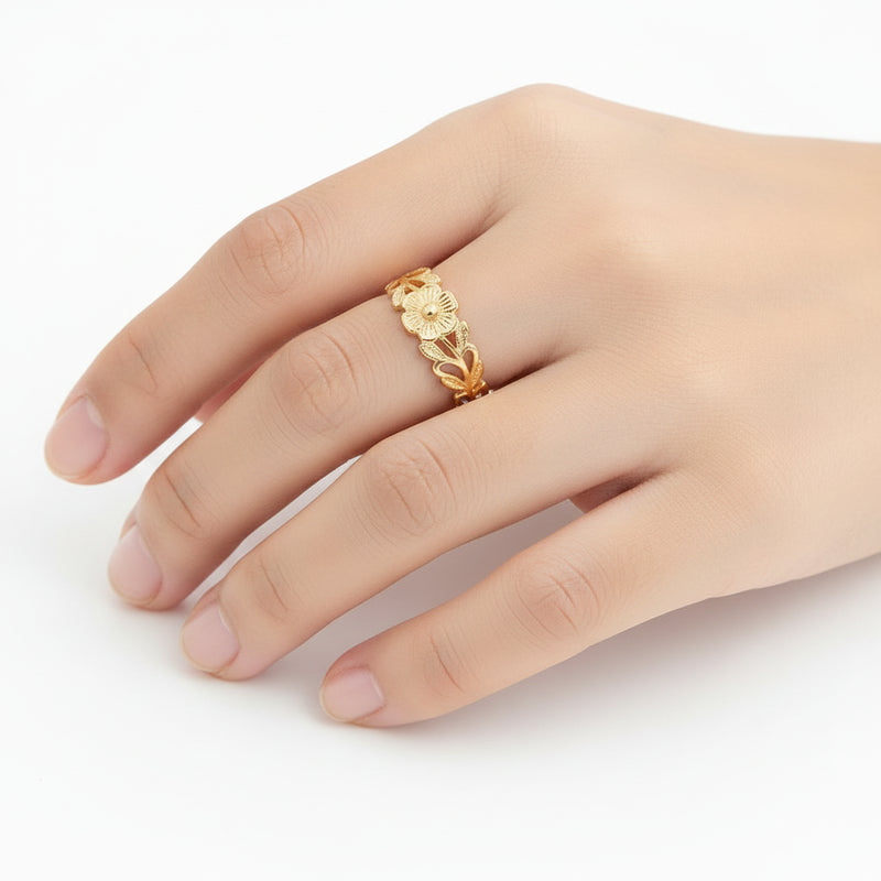 Set of gold rings with various designs on a white background