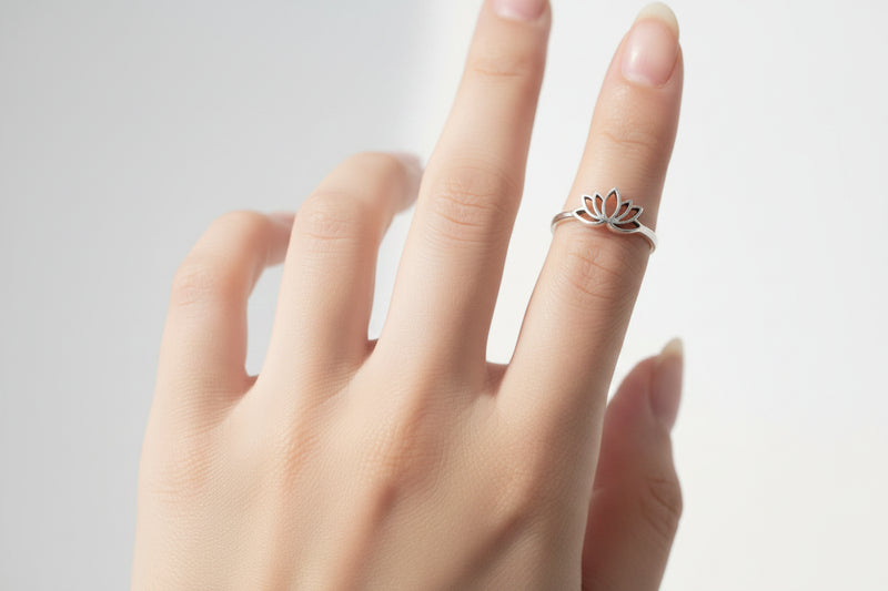 Collection of various silver rings on a white background